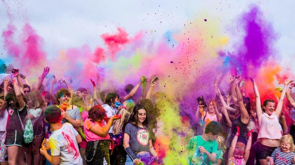 Group of Tourist Celebrating Holi Festival