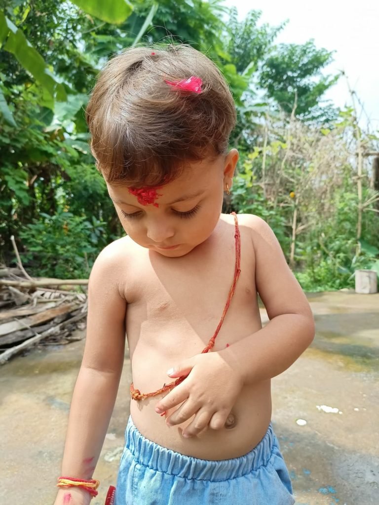 A Small boy wearing Sacred  Thread in Janai Purnima festival